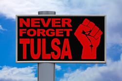 a sign that says "never forget tulsa"