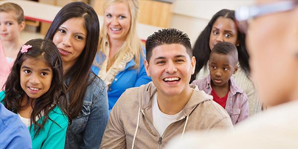 Diverse classroom with parents and children